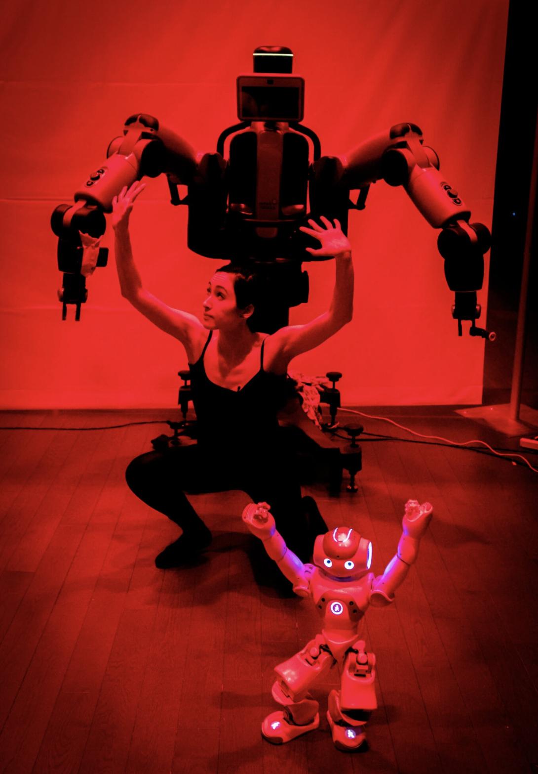 Catie Cuan with Rethink Robotics Baxter (big robot) and SoftBank Robotics NAO (small robot)