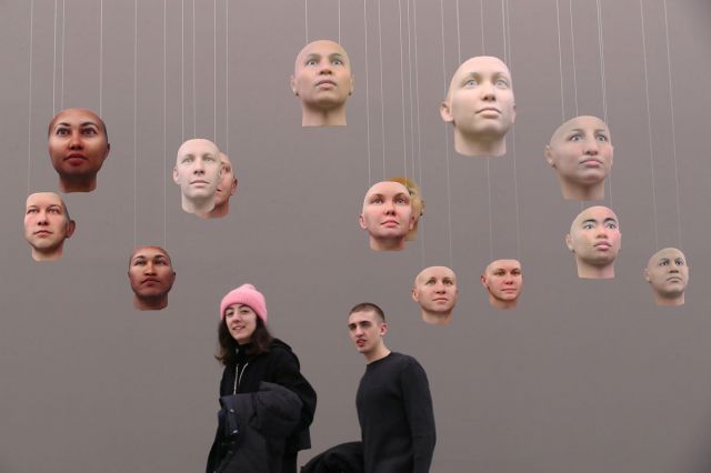 Face masks hanging in a gallery