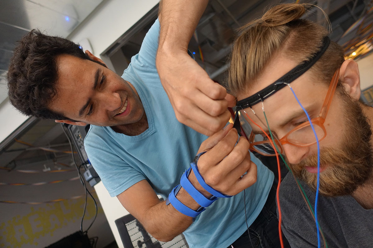 Engineers testing a headband prototype