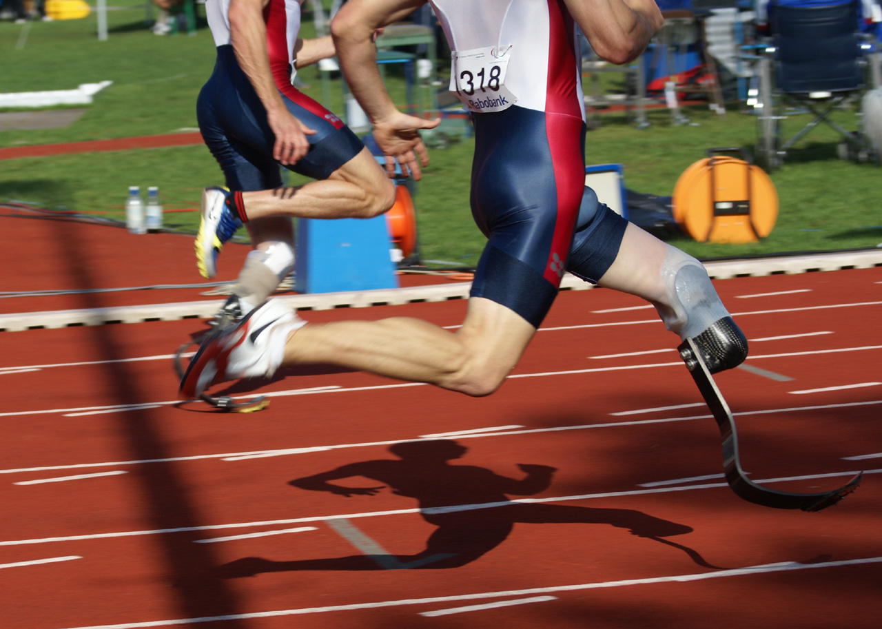 An athlete competing by running on a prosthetic leg