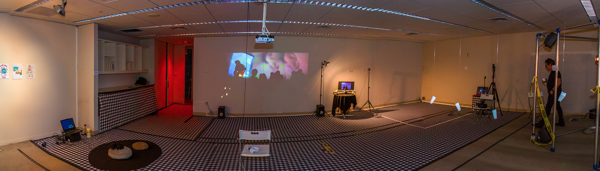 A wide shot of a room with various digtal art installations