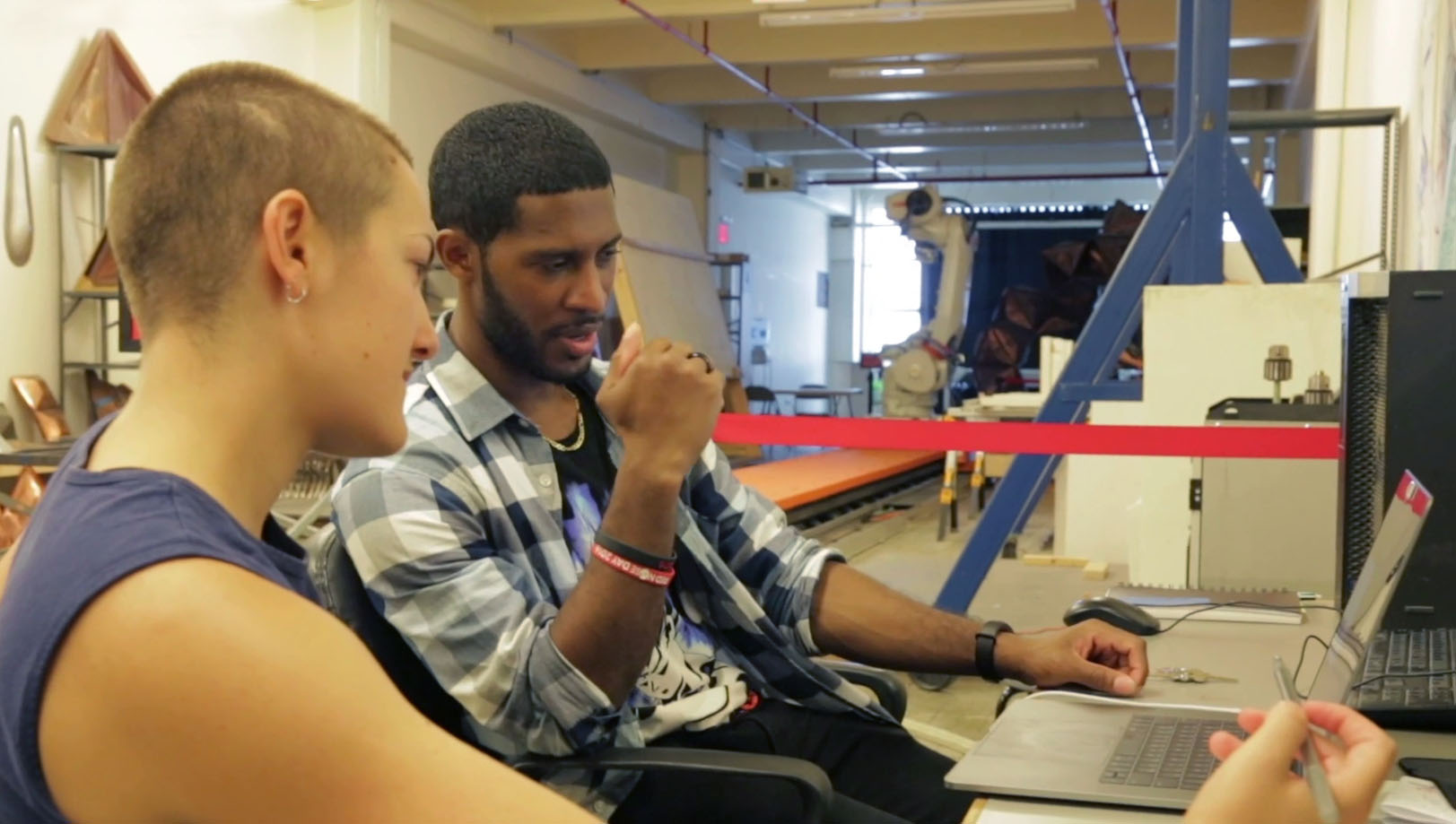 Engineers working in a robotics lab